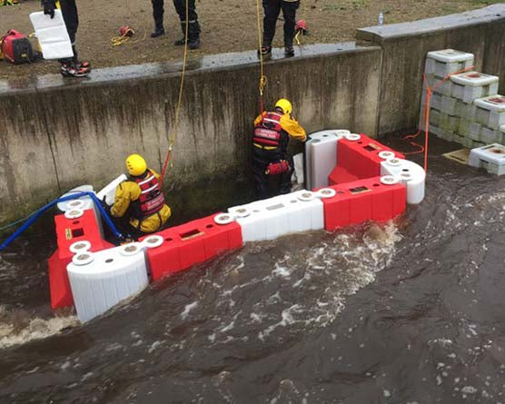 0.9m FloodStop barriers protecting workers in a river